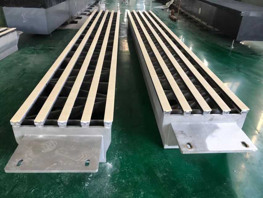 Ceramic and UHMWPE dewatering elements and suction box